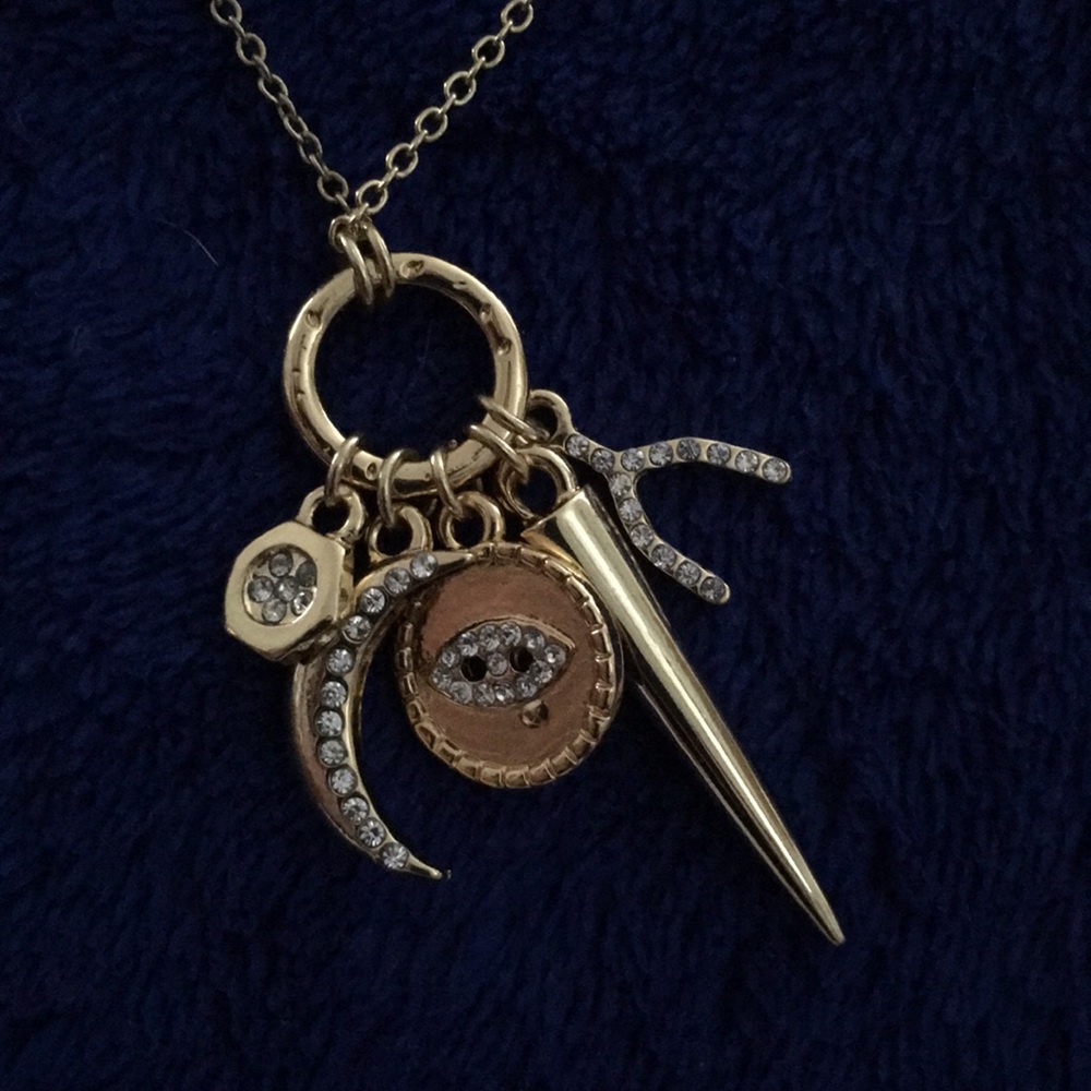 Ettika necklace w/ CZ charms: eye, moon, etc.